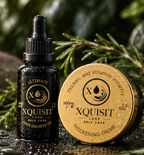 Xquisit hair oil and thickening cream with water droplets, surrounded by rosemary.