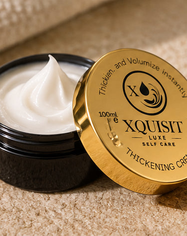 Open Xquisit thickening cream jar showing white cream beside its gold 100ml lid.