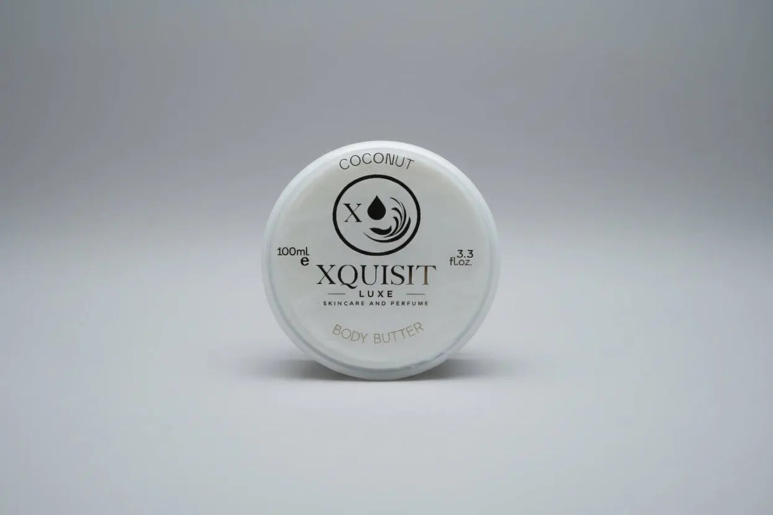 Xquisit Luxe coconut body butter container on a textured surface